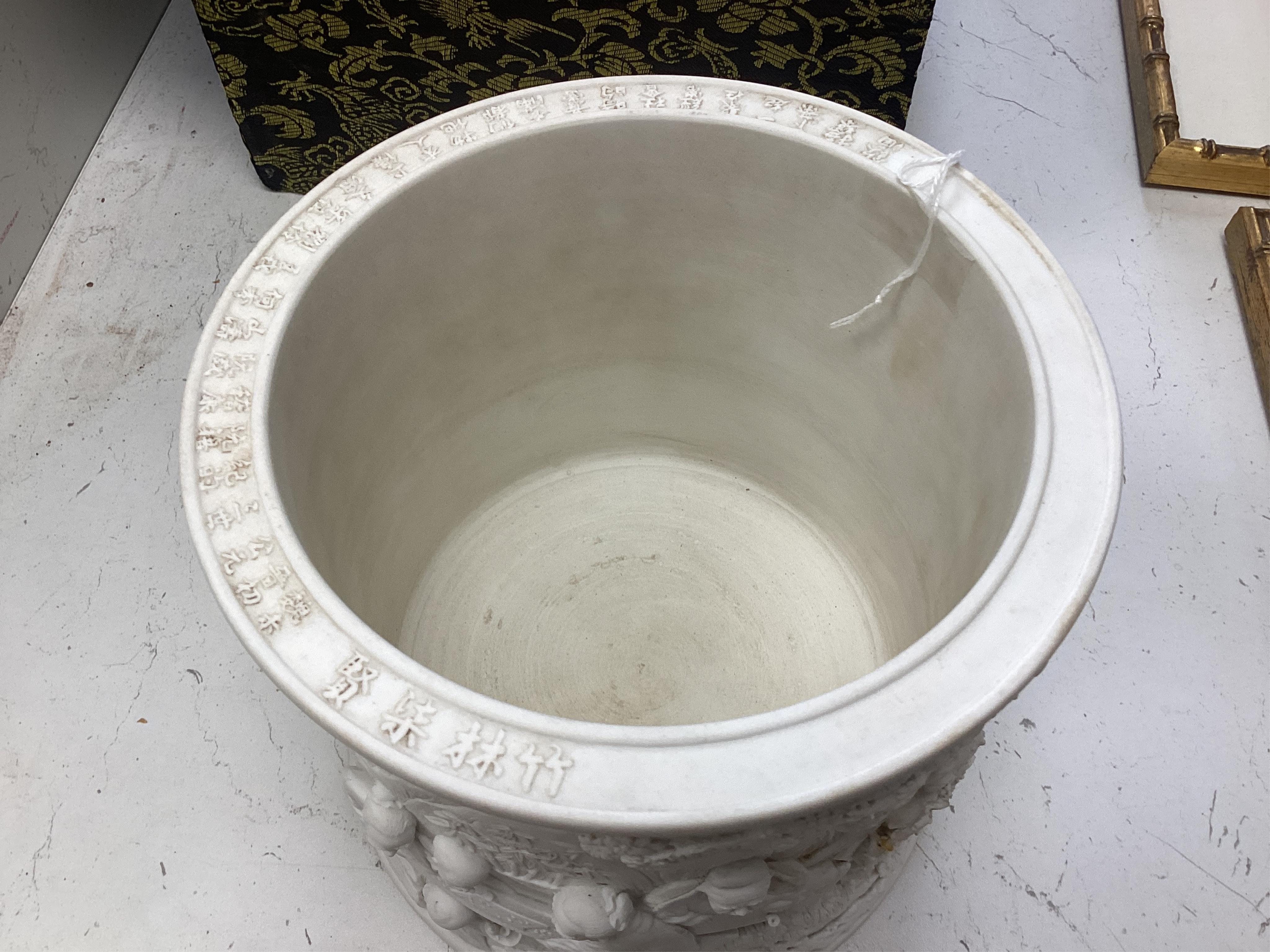 A Chinese biscuit porcelain ‘scholars’ brushpot, Daoguang mark but later, 17cm. Condition - fair to good